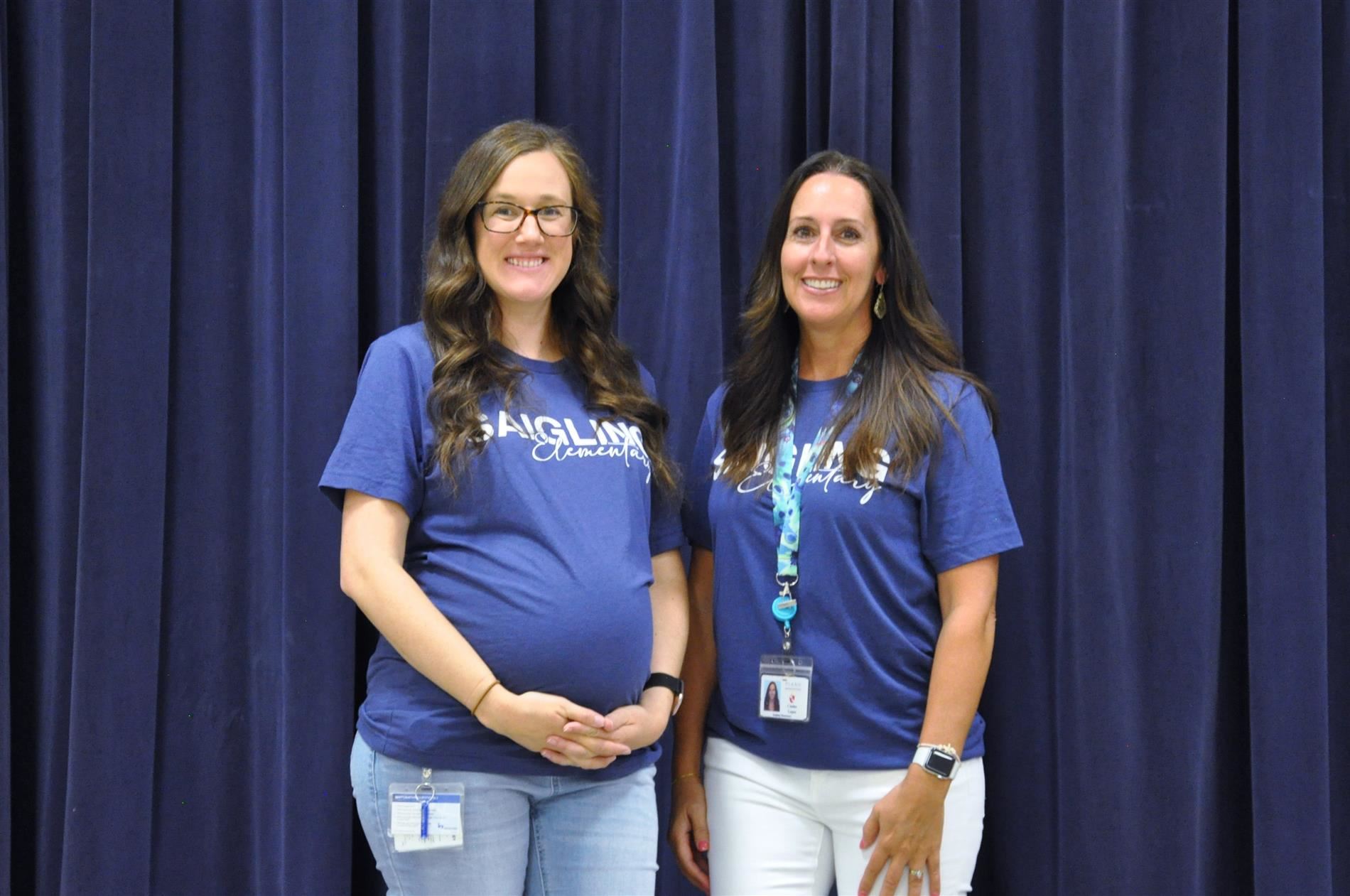 A picture of Ms. Hood, and Ms. Lopez standing next to each other smiling.